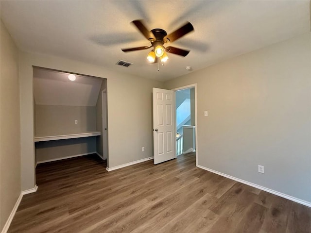 2009 Meadow View Dr, San Marcos, TX 78666 - unfurnished bedroom featuring wood finished floors, baseboards, and ceiling fan