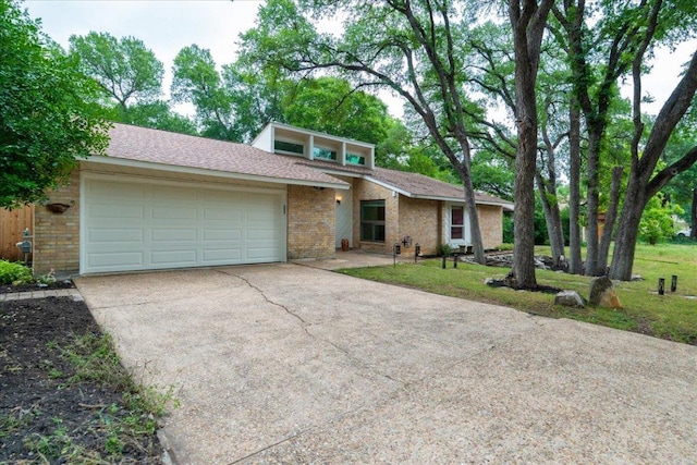 4831 Trail Crest Cir, Austin, TX 78735 - mid-century inspired home featuring brick siding, concrete driveway, a garage, and a front lawn