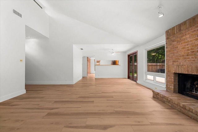 4831 Trail Crest Cir, Austin, TX 78735 - unfurnished living room featuring high vaulted ceiling, a brick fireplace, a ceiling fan, light wood-style floors, and baseboards