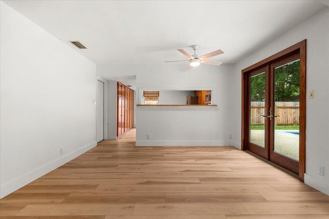 4831 Trail Crest Cir, Austin, TX 78735 - unfurnished living room with french doors, light wood-style flooring, and ceiling fan