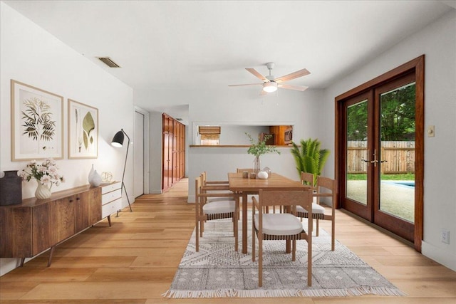 4831 Trail Crest Cir, Austin, TX 78735 - dining space featuring french doors, light wood finished floors, and a ceiling fan