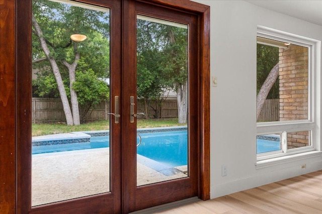 4831 Trail Crest Cir, Austin, TX 78735 - entryway with french doors, wood finished floors, and healthy amount of natural light