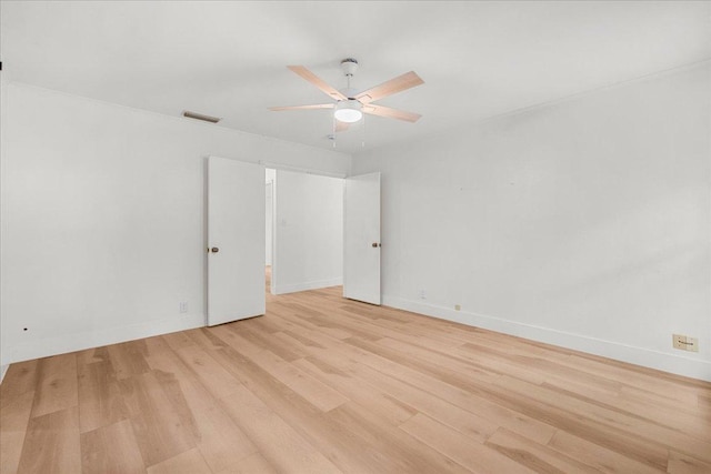 4831 Trail Crest Cir, Austin, TX 78735 - empty room with light wood-style floors, a ceiling fan, and baseboards