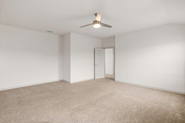 117 Scarborough Way, San Marcos, TX 78666 - unfurnished bedroom with light carpet, baseboards, ceiling fan, and vaulted ceiling