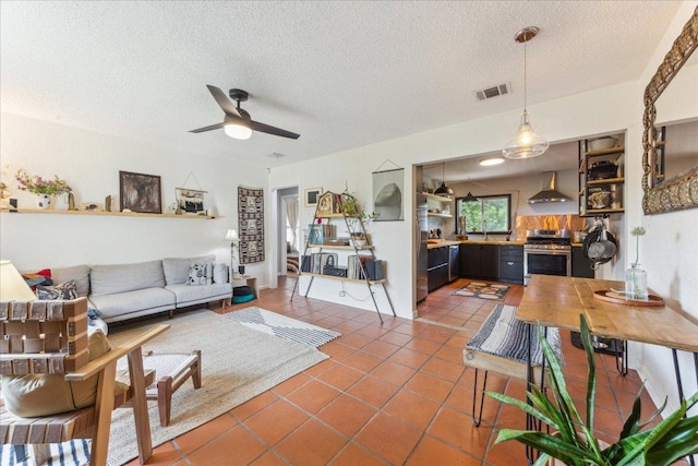 3409 Kay St, Austin, TX 78702 - tiled living room featuring a textured ceiling and a ceiling fan