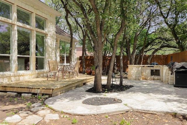 7921 Davis Mountain Pass, Austin, TX 78726 - fenced backyard with area for grilling, a deck, outdoor dining space, and a patio