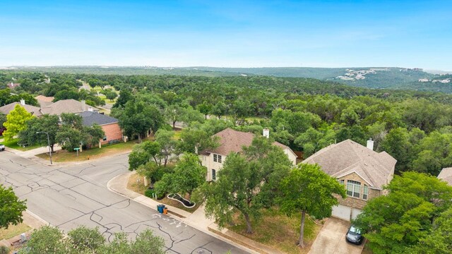 7921 Davis Mountain Pass, Austin, TX 78726 - aerial perspective of suburban area with a heavily wooded area