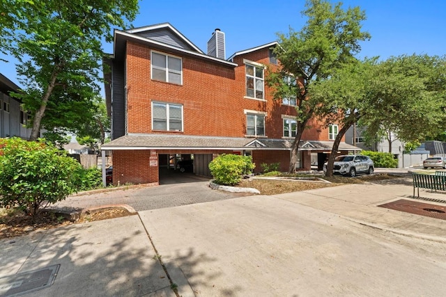 2804 Rio Grande St Unit 206, Austin, TX 78705 - view of front of property with brick siding and a chimney