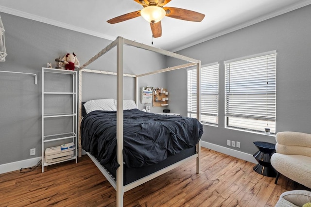 2804 Rio Grande St Unit 206, Austin, TX 78705 - bedroom featuring crown molding, wood finished floors, baseboards, and ceiling fan