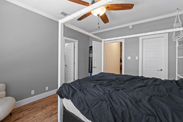 2804 Rio Grande St Unit 206, Austin, TX 78705 - bedroom with wood finished floors, ornamental molding, baseboards, and ceiling fan