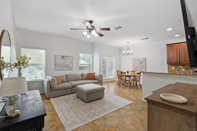 11237 Lost Maples Trl, Austin, TX 78748 - living room featuring ceiling fan, ornamental molding, a chandelier, recessed lighting, and baseboards