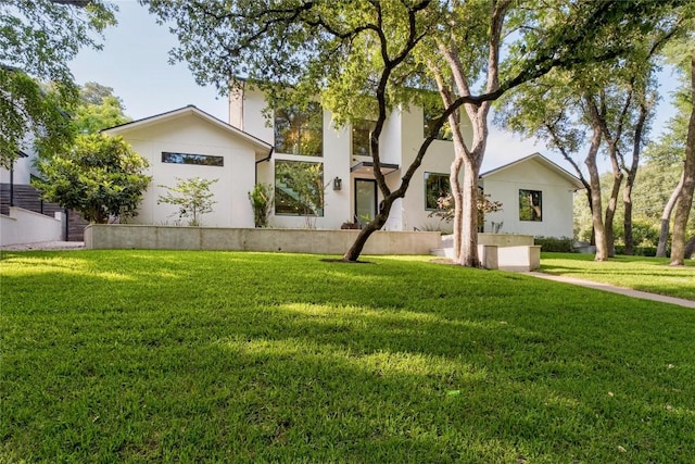 4901 Southcrest Dr, Austin, TX 78746 - view of front of house featuring a front yard and stucco siding