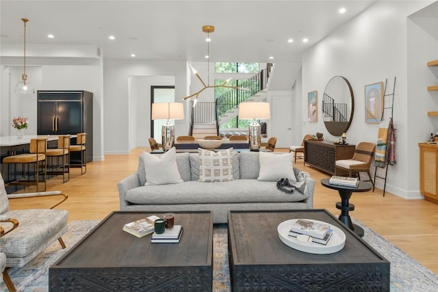4901 Southcrest Dr, Austin, TX 78746 - living area with stairs, light wood-style floors, recessed lighting, and baseboards