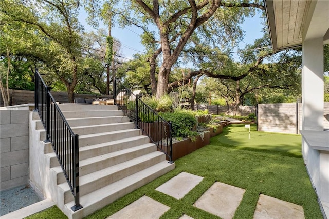 4901 Southcrest Dr, Austin, TX 78746 - view of yard featuring a putting area and stairway