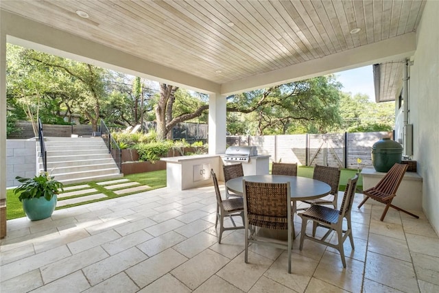 4901 Southcrest Dr, Austin, TX 78746 - fenced backyard with outdoor dining area, a patio, and stairway