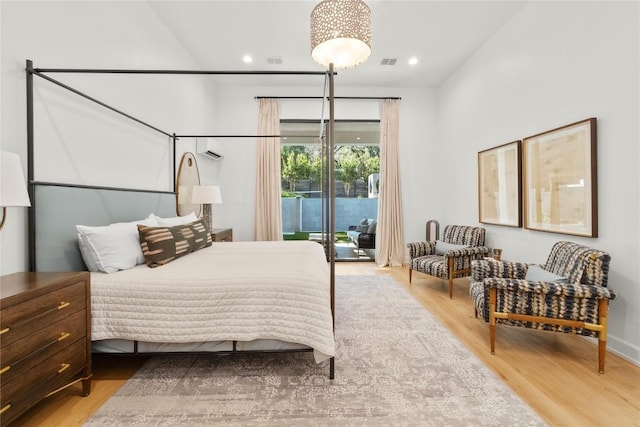 4901 Southcrest Dr, Austin, TX 78746 - bedroom with access to outside, wood finished floors, and recessed lighting