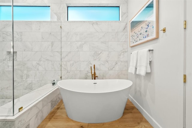 4901 Southcrest Dr, Austin, TX 78746 - full bath with a freestanding bath and wood finished floors