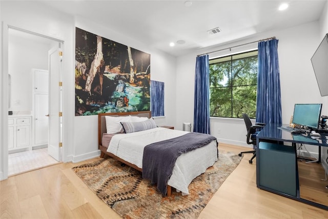 4901 Southcrest Dr, Austin, TX 78746 - bedroom with wood finished floors, recessed lighting, an office area, baseboards, and ensuite bathroom