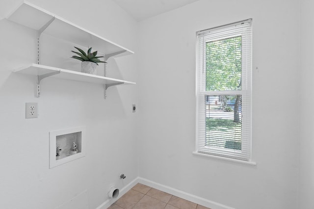 2804 Bushnell Dr, Austin, TX 78745 - laundry room with hookup for a washing machine, hookup for an electric dryer, and light tile patterned floors