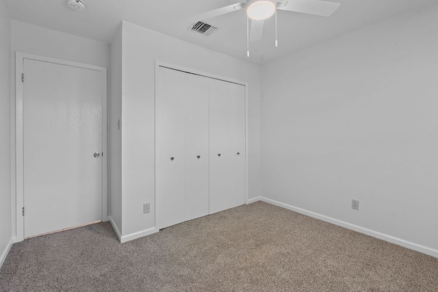 2804 Bushnell Dr, Austin, TX 78745 - unfurnished bedroom featuring carpet, a closet, and a ceiling fan