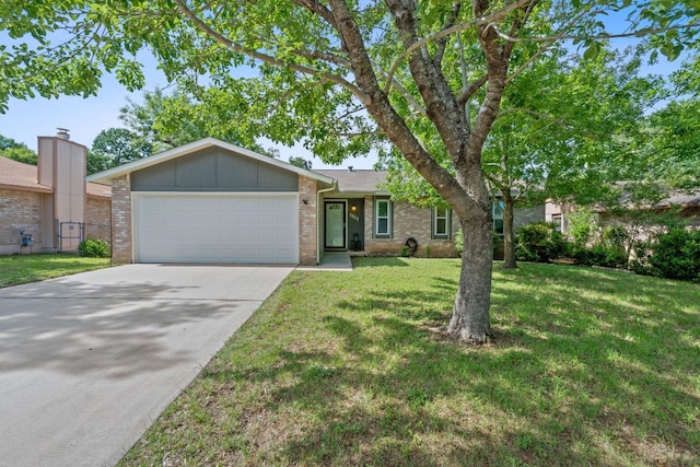 2804 Bushnell Dr, Austin, TX 78745 - ranch-style house featuring an attached garage, brick siding, concrete driveway, and board and batten siding