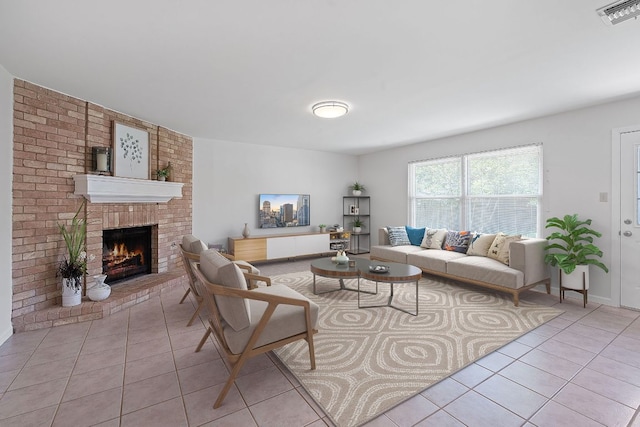 2804 Bushnell Dr, Austin, TX 78745 - living room featuring light tile patterned floors and a brick fireplace