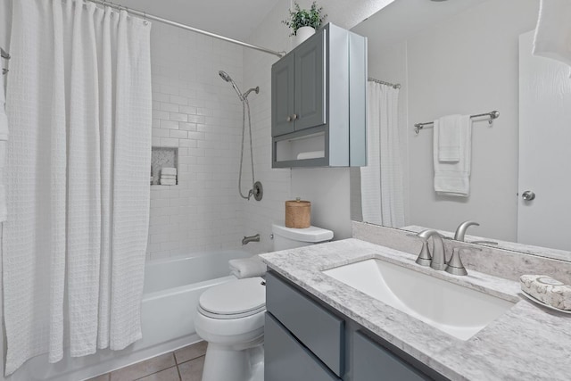 2804 Bushnell Dr, Austin, TX 78745 - bathroom featuring shower / bath combo with shower curtain, vanity, toilet, and tile patterned flooring