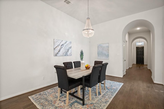 136 Medina Hills Ct, Austin, TX 78737 - dining area with arched walkways, dark wood-type flooring, and baseboards