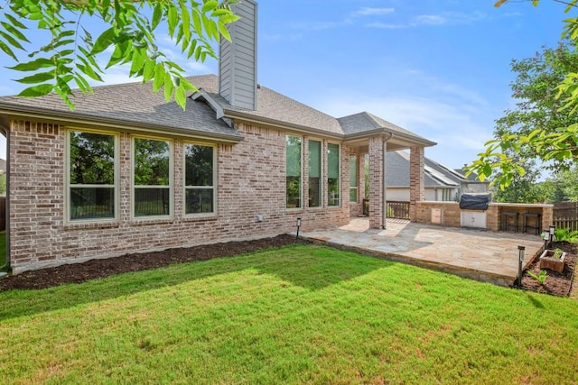 136 Medina Hills Ct, Austin, TX 78737 - back of property with a patio, a chimney, and brick siding