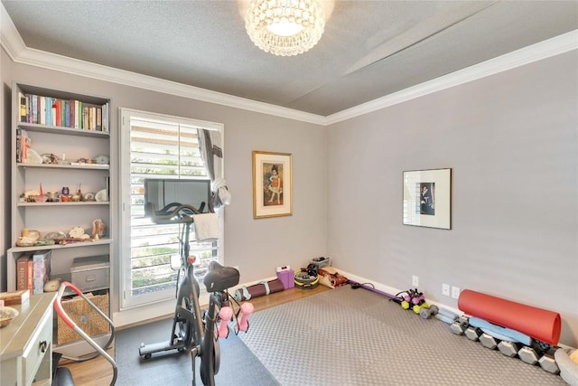 2602 Rollingwood Dr, Rollingwood, TX 78746 - exercise room with crown molding, a chandelier, and baseboards