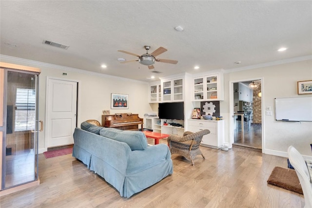 2602 Rollingwood Dr, Rollingwood, TX 78746 - living room with ornamental molding, ceiling fan, light wood finished floors, baseboards, and recessed lighting