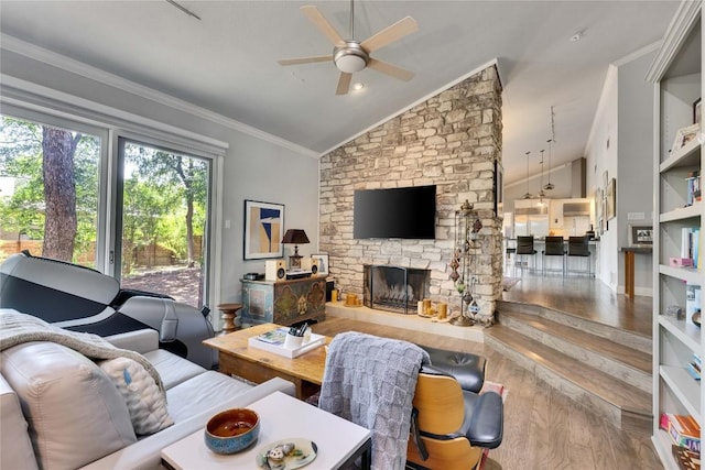 2602 Rollingwood Dr, Rollingwood, TX 78746 - living area featuring vaulted ceiling, wood finished floors, a ceiling fan, crown molding, and a fireplace