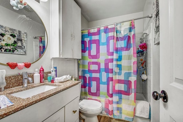 8505 Dryfield Dr, Austin, TX 78758 - bathroom featuring vanity, shower / bath combination with curtain, toilet, and wood finished floors
