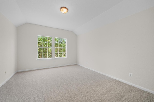 12304 Buvana Dr, Austin, TX 78739 - empty room with lofted ceiling, carpet floors, and baseboards