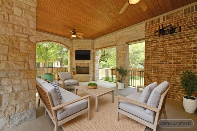 12304 Buvana Dr, Austin, TX 78739 - view of patio with a ceiling fan and an outdoor living space with a fireplace