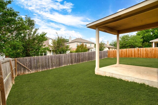117 N Maplewood, Kyle, TX 78640 - fenced backyard with a patio