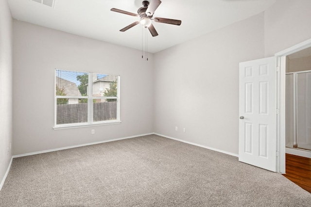 117 N Maplewood, Kyle, TX 78640 - empty room with a ceiling fan and dark carpet