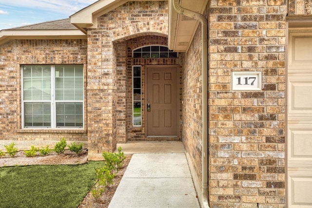 117 N Maplewood, Kyle, TX 78640 - entrance to property with brick siding and roof with shingles