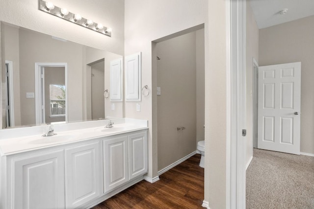 117 N Maplewood, Kyle, TX 78640 - bathroom with double vanity and wood finished floors