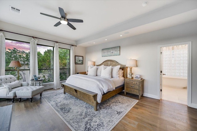 921 Electra, Lakeway, TX 78734 - bedroom featuring wood finished floors, recessed lighting, baseboards, ensuite bathroom, and a ceiling fan