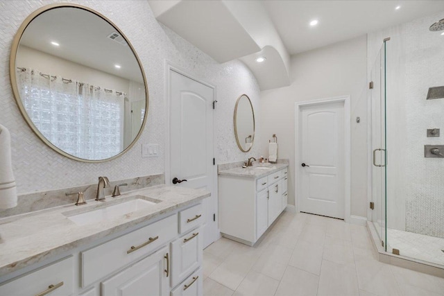 921 Electra, Lakeway, TX 78734 - full bath featuring a shower stall, two vanities, tile patterned flooring, and recessed lighting