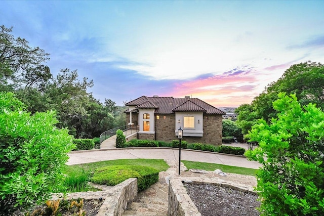 921 Electra, Lakeway, TX 78734 - mediterranean / spanish house featuring a tile roof and stucco siding