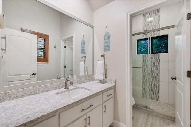 921 Electra, Lakeway, TX 78734 - bathroom featuring vanity, a shower stall, and toilet