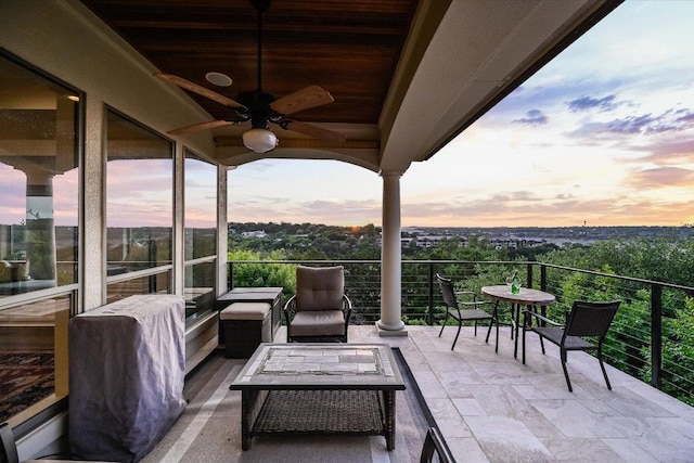 921 Electra, Lakeway, TX 78734 - patio terrace at dusk featuring ceiling fan and a balcony