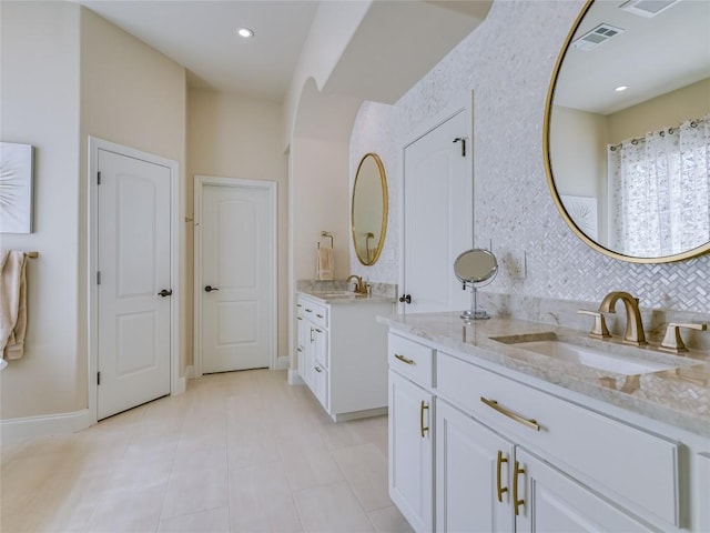 921 Electra, Lakeway, TX 78734 - full bathroom with two vanities, tile patterned floors, baseboards, and recessed lighting