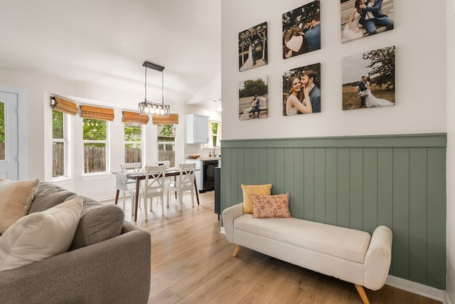 215 Crystal Knoll Blvd, Georgetown, TX 78626 - living room featuring light wood-style flooring and wainscoting