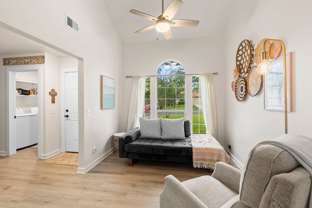 215 Crystal Knoll Blvd, Georgetown, TX 78626 - living area featuring washer / clothes dryer, high vaulted ceiling, light wood finished floors, ceiling fan, and baseboards
