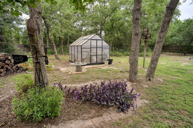 233 Maple Leaf Trl, Elgin, TX 78621 - view of yard with a greenhouse and an outdoor structure