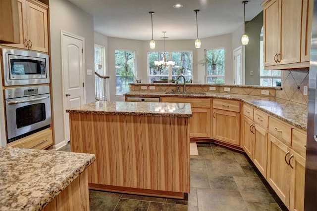 233 Maple Leaf Trl, Elgin, TX 78621 - kitchen with appliances with stainless steel finishes, light brown cabinetry, a sink, backsplash, and recessed lighting