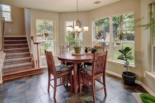 233 Maple Leaf Trl, Elgin, TX 78621 - dining space featuring stairs, baseboards, a chandelier, and plenty of natural light